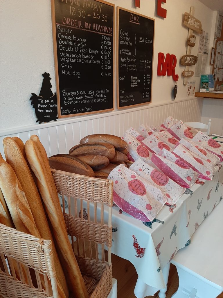 Campsite reception selling fresh bread and takeaway food and drinks